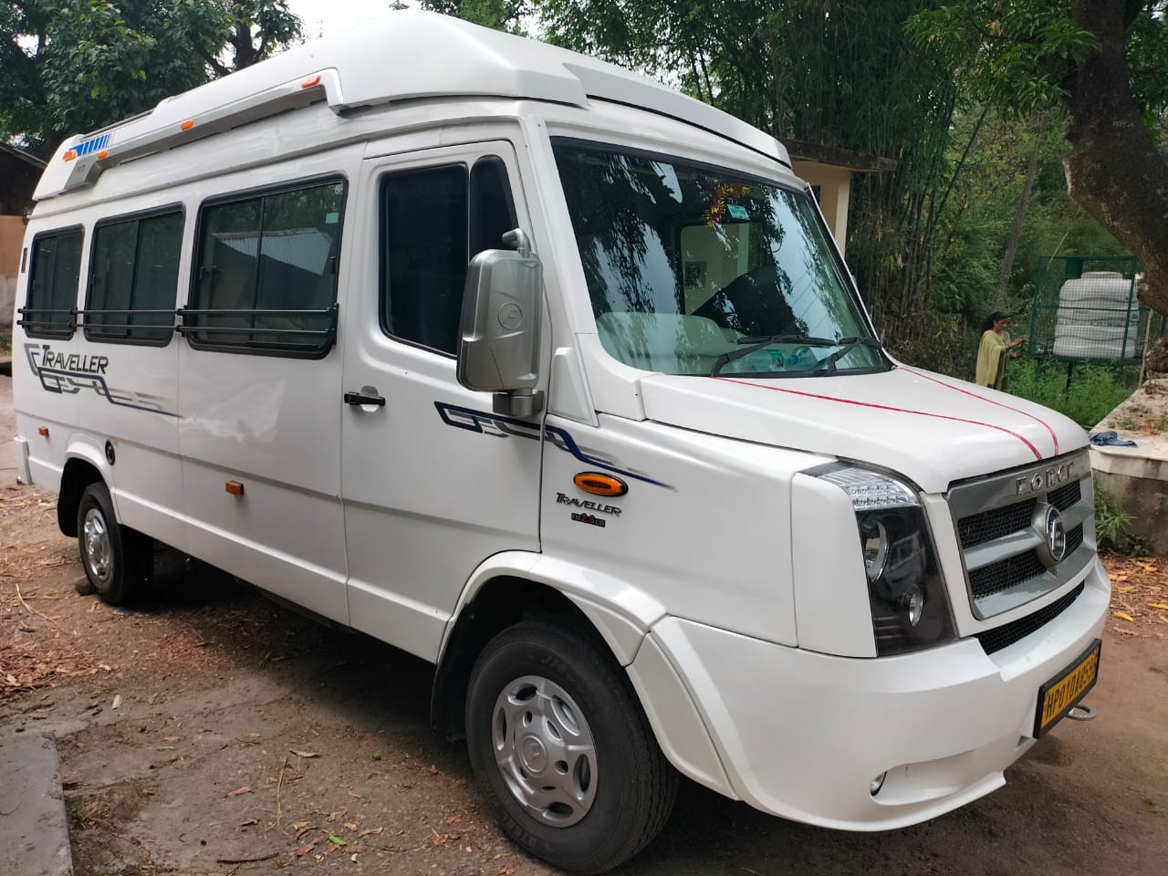 Traveler enjoying a scenic journey through Himachal Pradesh in a comfortable taxi, perfect for sightseeing and exploration